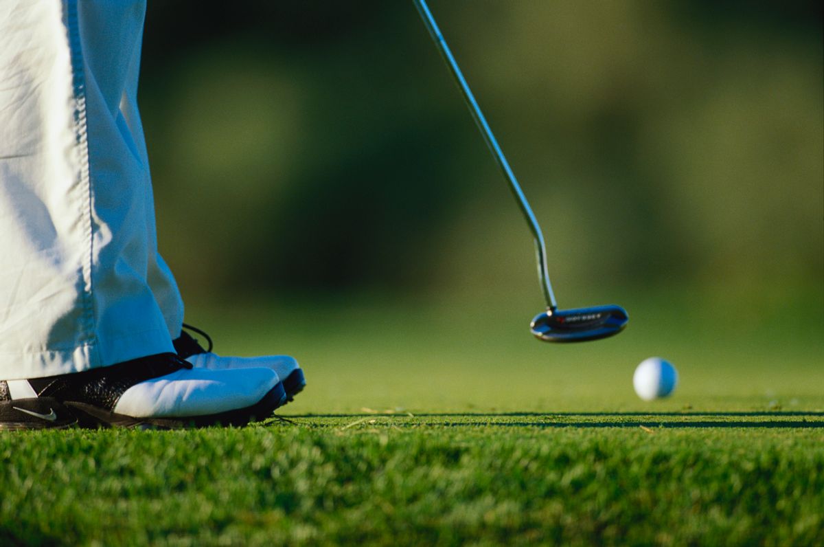 A golfer putting at the Hazeltine National Golf Course during the 2002 PGA Championship.