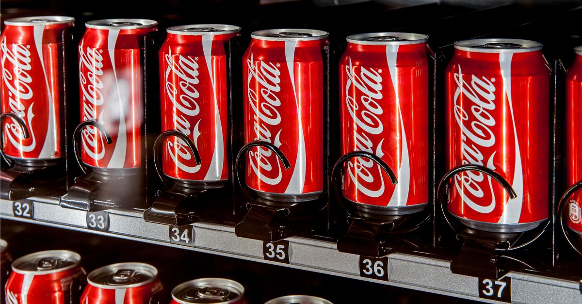 Coca-Cola cans in a vending machine