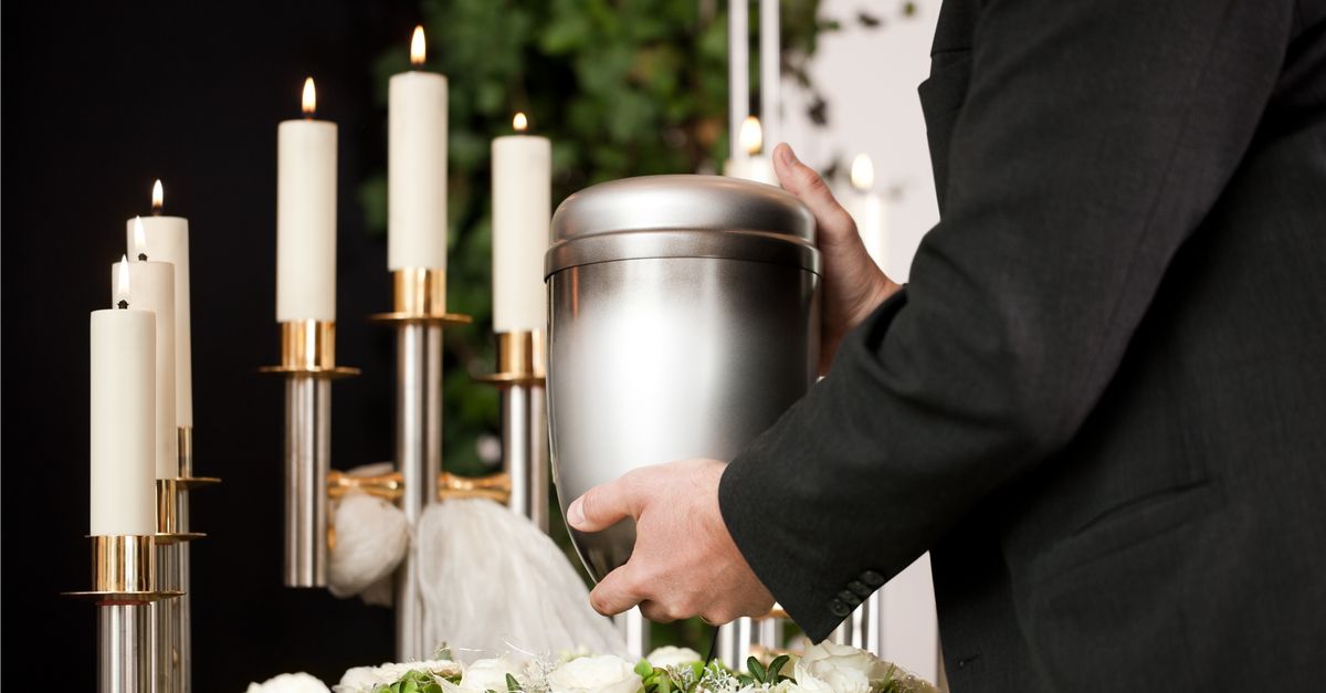 Man holding an urn.