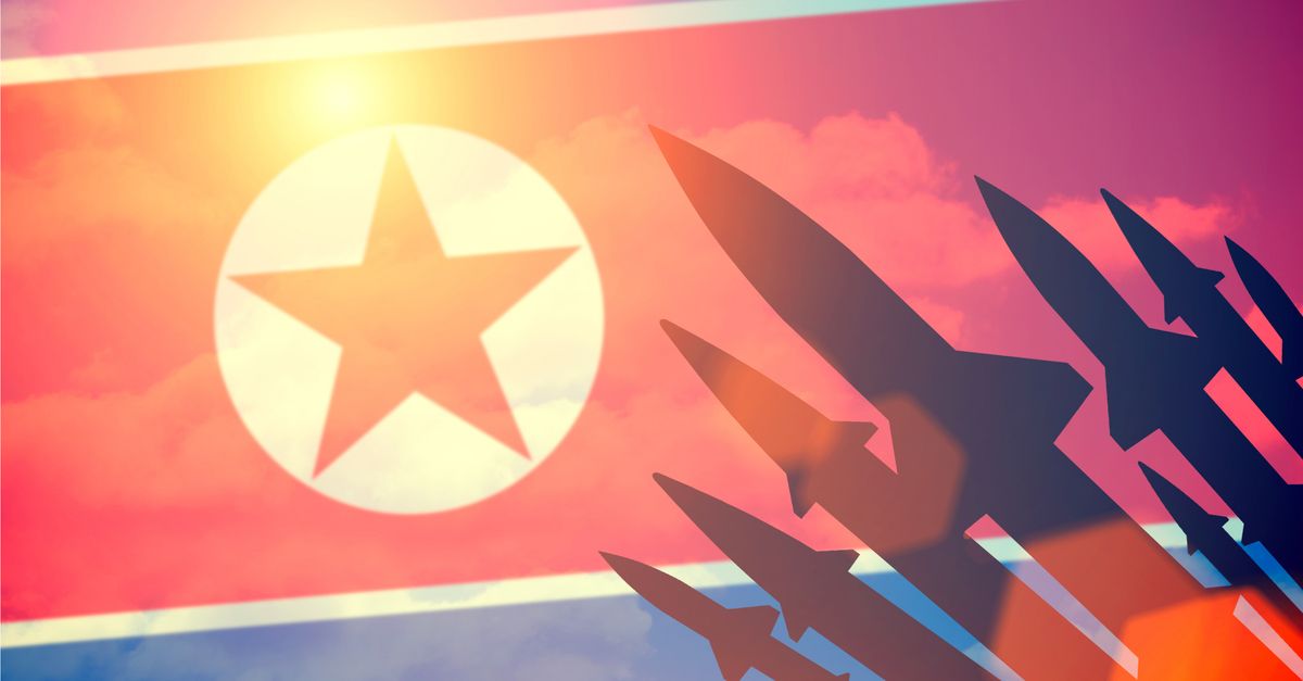 North Korean flag with missile silhouettes.