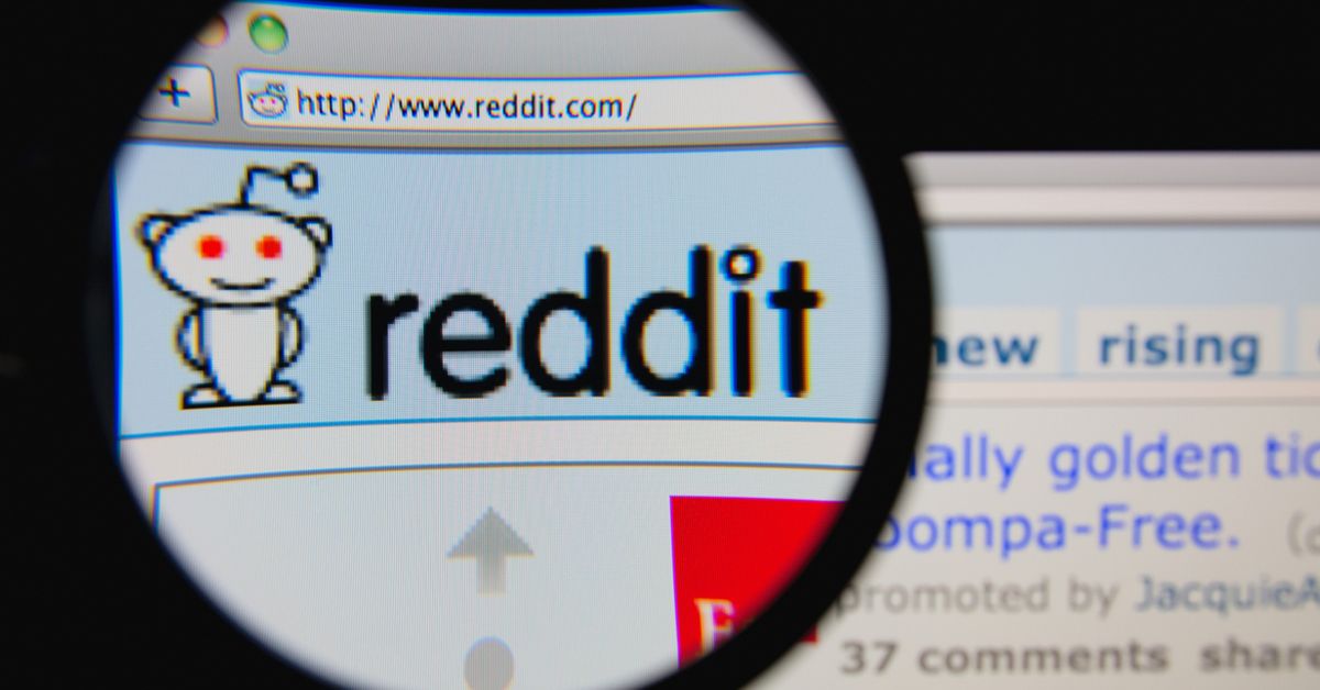 magnifying glass over Reddit homepage