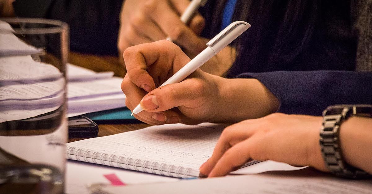 Student taking notes