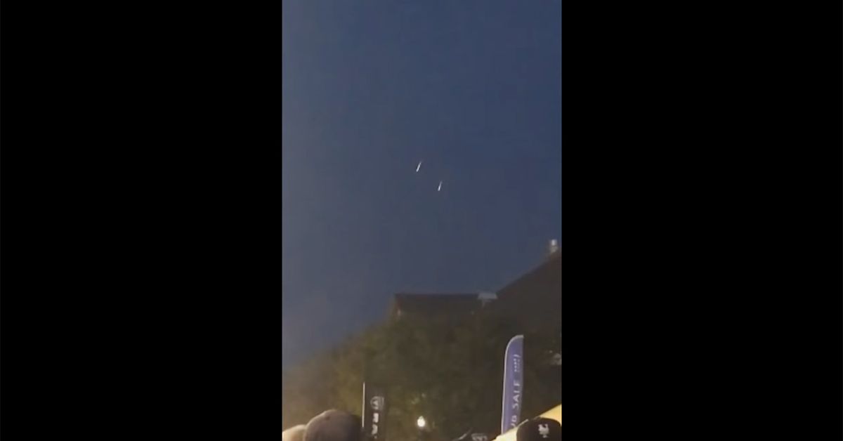 Still from a video purporting to show UFOs over Oklahoma City (but actually show Navy paratroopers over Utah)