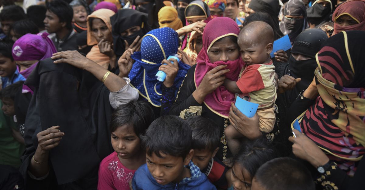 COX' BAZAR, BANGLADESH - MARCH 16, 2017 : Rohingya refugees from Myanmar waiting for food aid in Kutupalong refugee camp near Cox's Bazar, Bangladesh.
