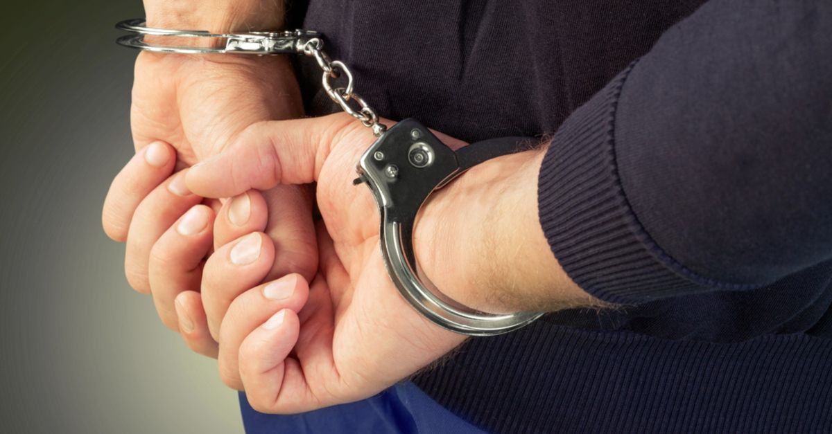 Person handcuffed behind their back
