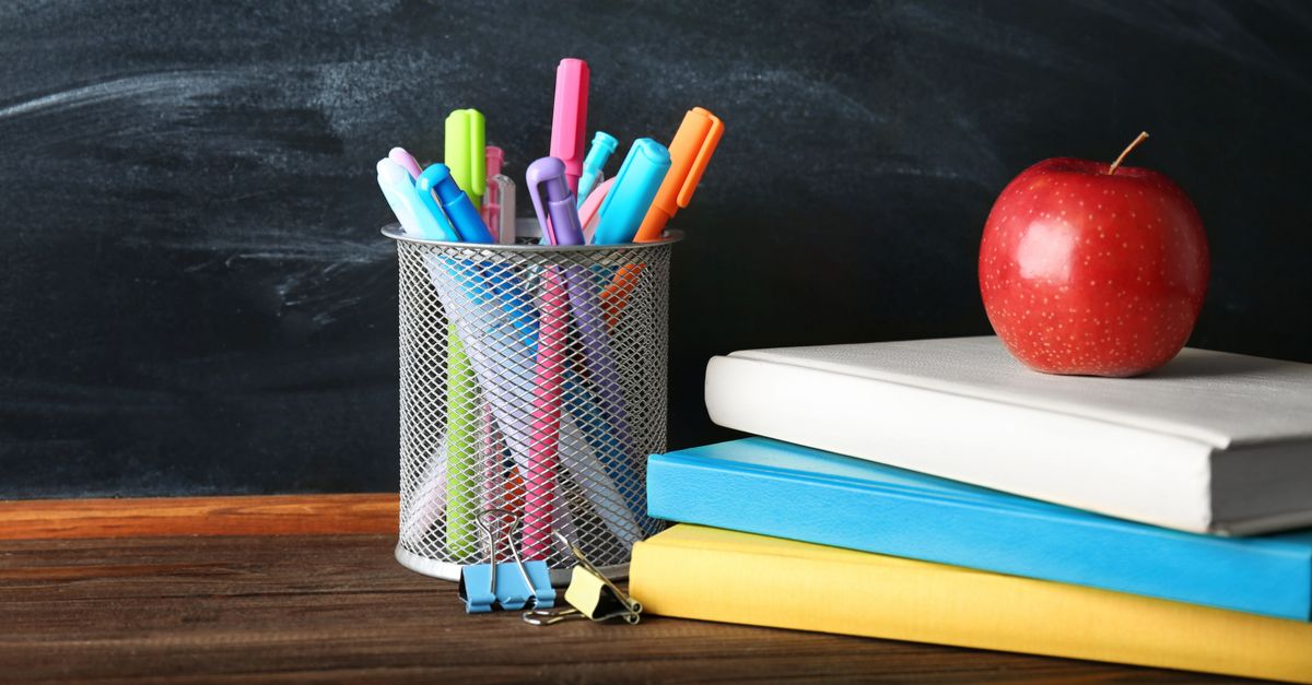 School books in front of black board