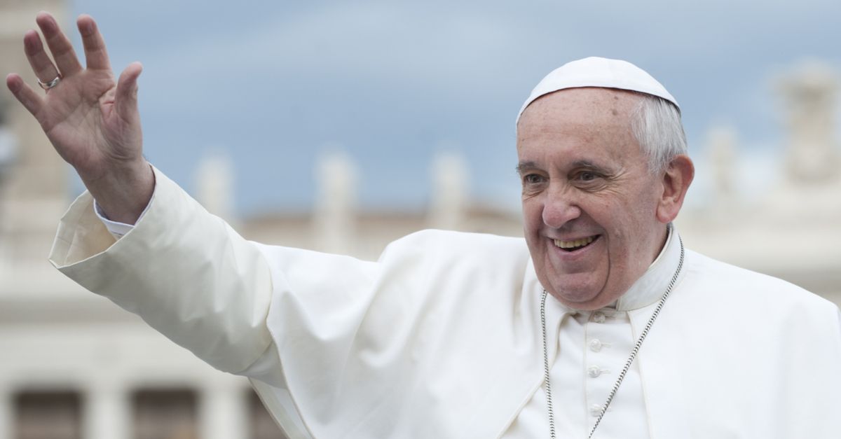 Pope Francis waving from the Popemobile.