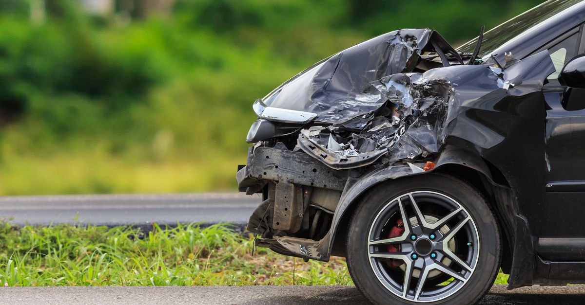 Car with crushed front bumper from an accident