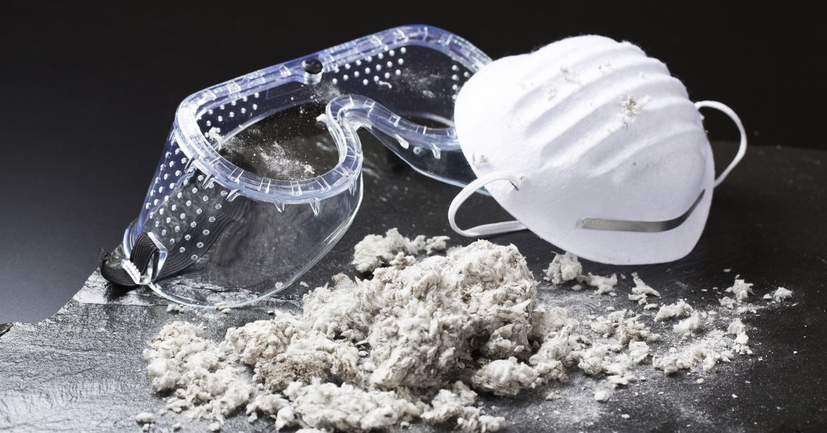 Concept piece showing asbestos alongside safety goggles and a mask.