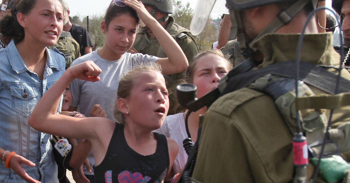 girl confronts soldier