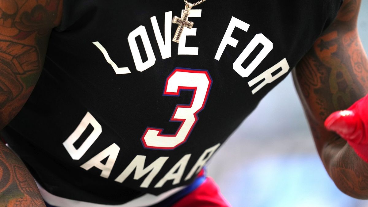 Xavier McKinney wearing Damar Hamlin shirt
