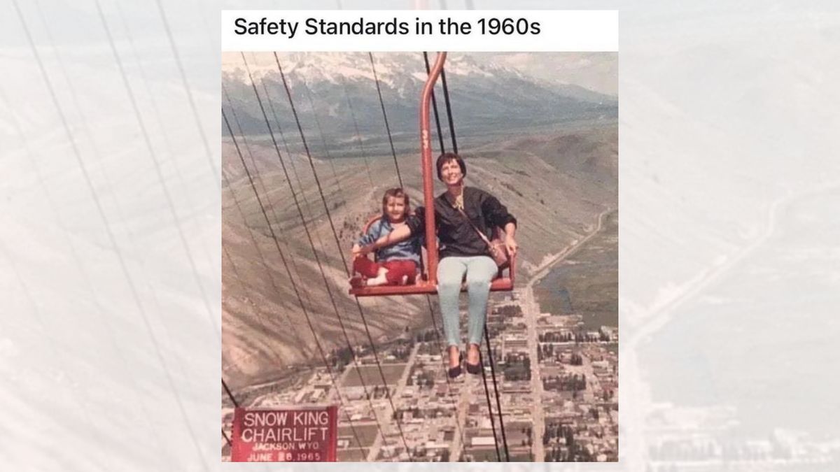An adult holds their arm in front of a child on a chairlift. The caption reads, "Safety Standards in the 1960s."