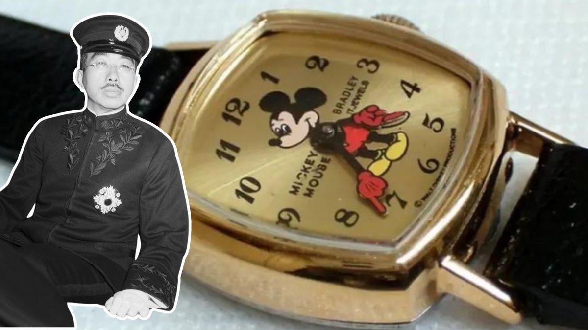 An Asian man wearing an uniform is pictured next to a watch with a mouse on it. The clock says Mickey Mouse on it.