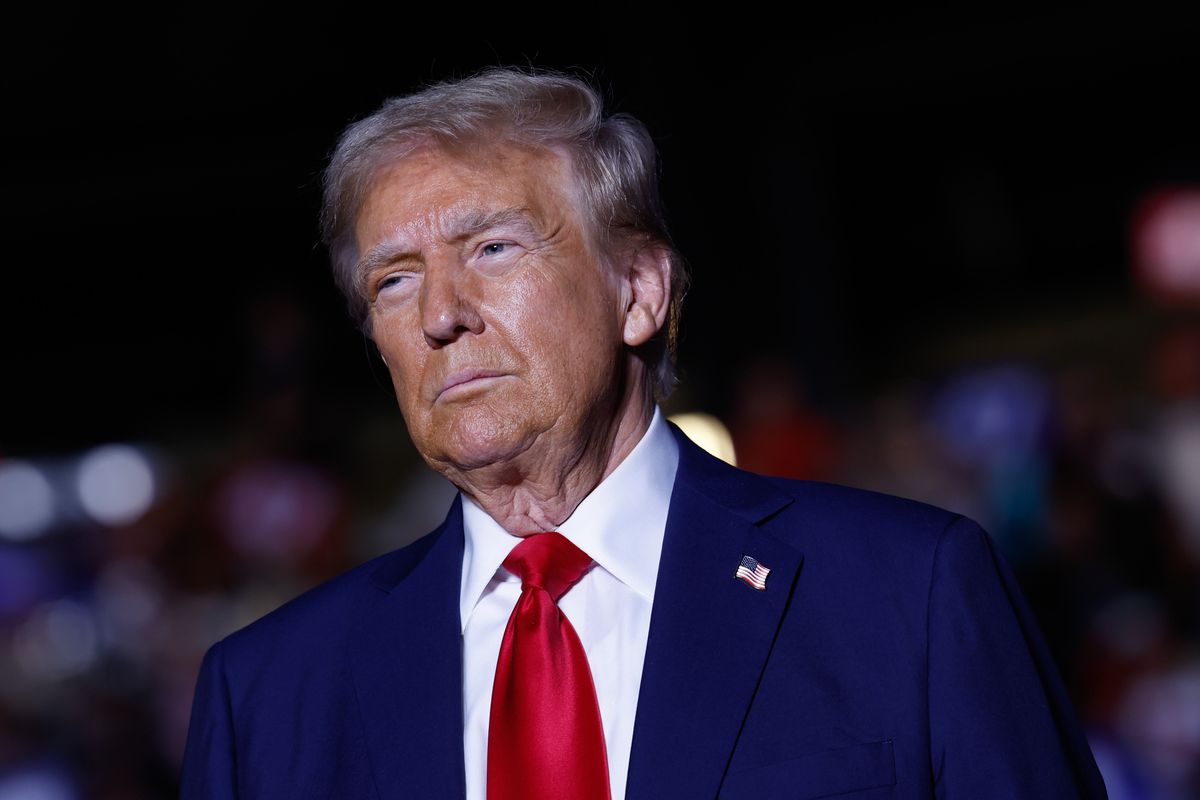 A white man in a blue suit is pictured.