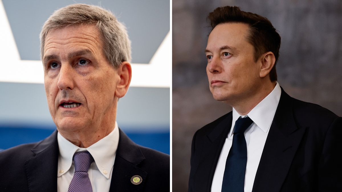 Two white men wearing black suits are pictured next to each other. One is looking forward + speaking, while the other on the right is looking towards the left side.