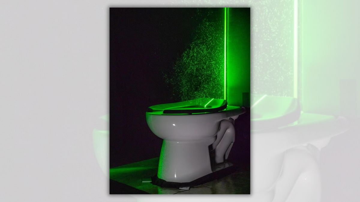A toilet is shown with a green aura around a tole attached to it. Green particles appear around the pole and at the top of the toilet.