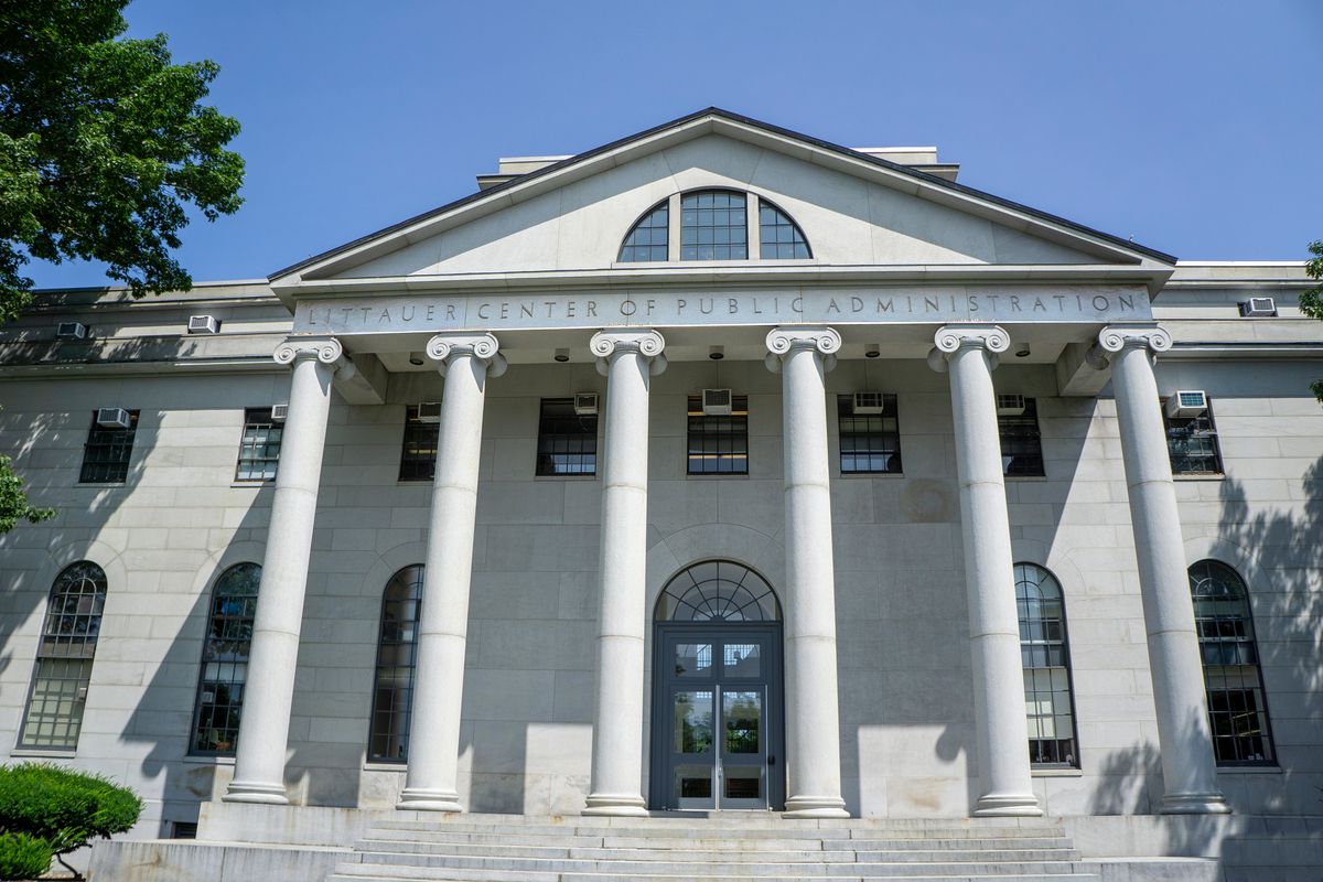 The outside of a white building is shown.