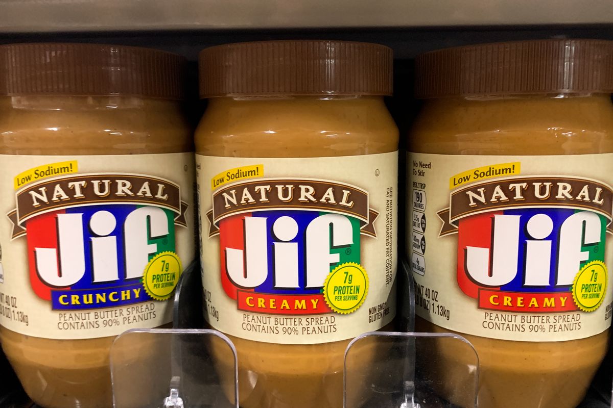 Three bottles of Natural Jif Creamy peanut butter are shown next to each other.