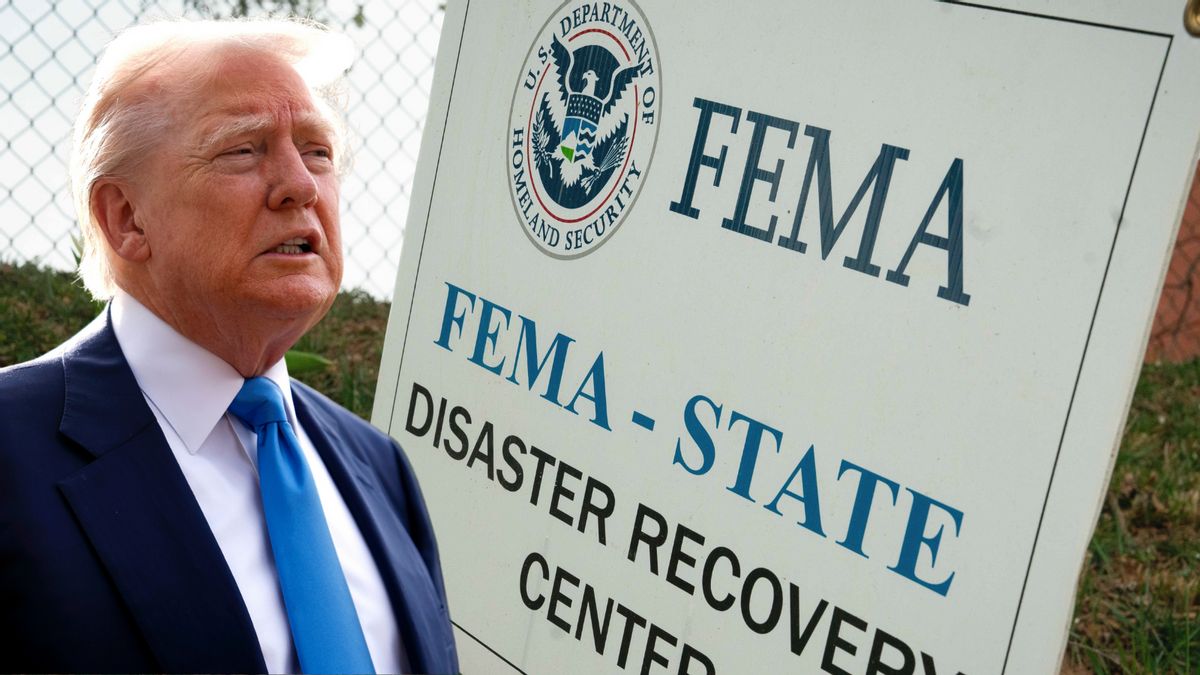 A white man wearing a blue suit is pictured next to a sign that says FEMA - STATE DISASTER RECOVERY CENTER.