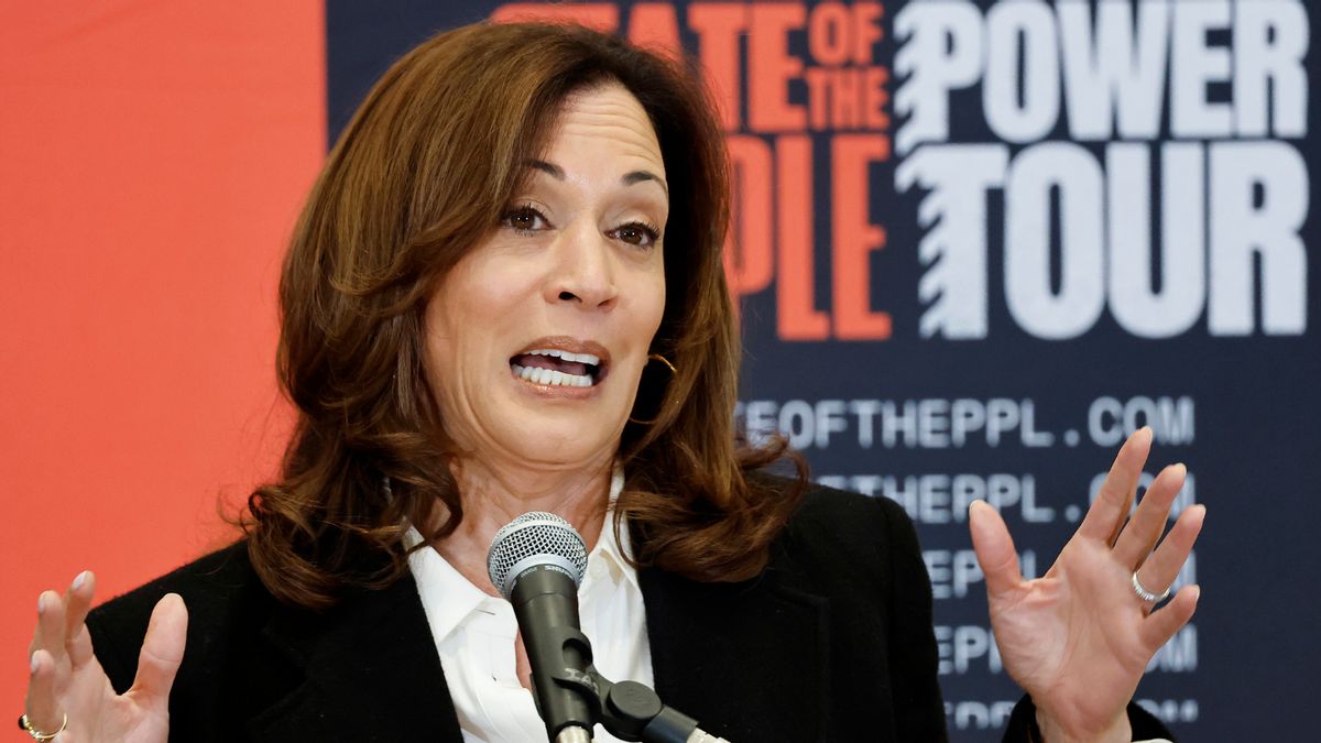 Former Vice President Kamala Harris speaks at a podium in front of a backdrop that reads “State of the People Power Tour.”