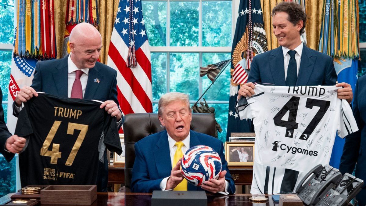 Two white men smile while holding jerseys that say TRUMP 47 on them. They are smiling at a man in the middle holding a soccer ball.