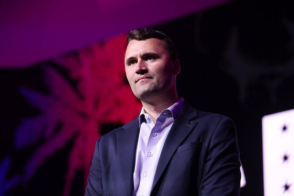 A white man with short brown hair wearing a suit. 