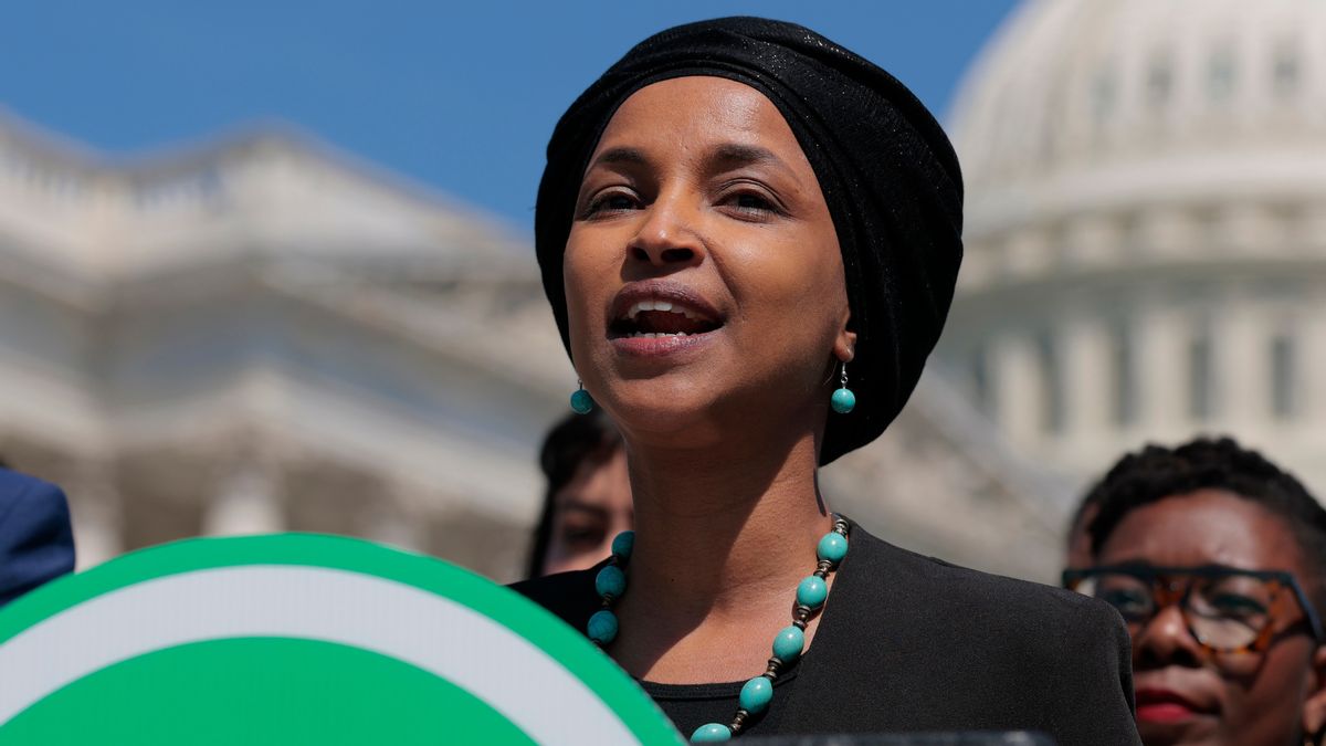 Rep. Ilhan Omar, a Somali American woman wearing a headwrap, speaks in front of the White House. 