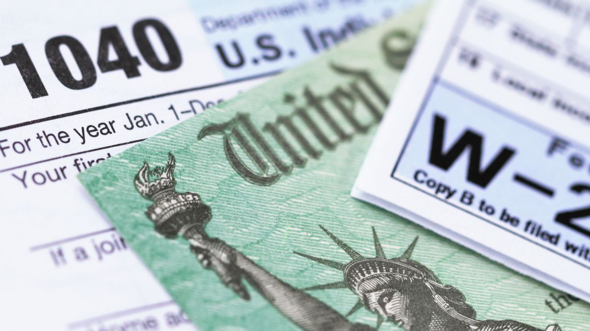 A close-up picture of 1040 and W-2 tax forms.