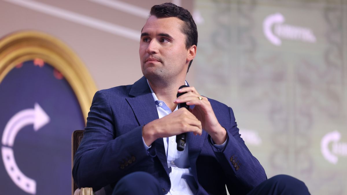 The conservative commentator Charlie Kirk holds a microphone while addressing the 2025 Young Women's Leadership Summit in Grapevine, Texas.