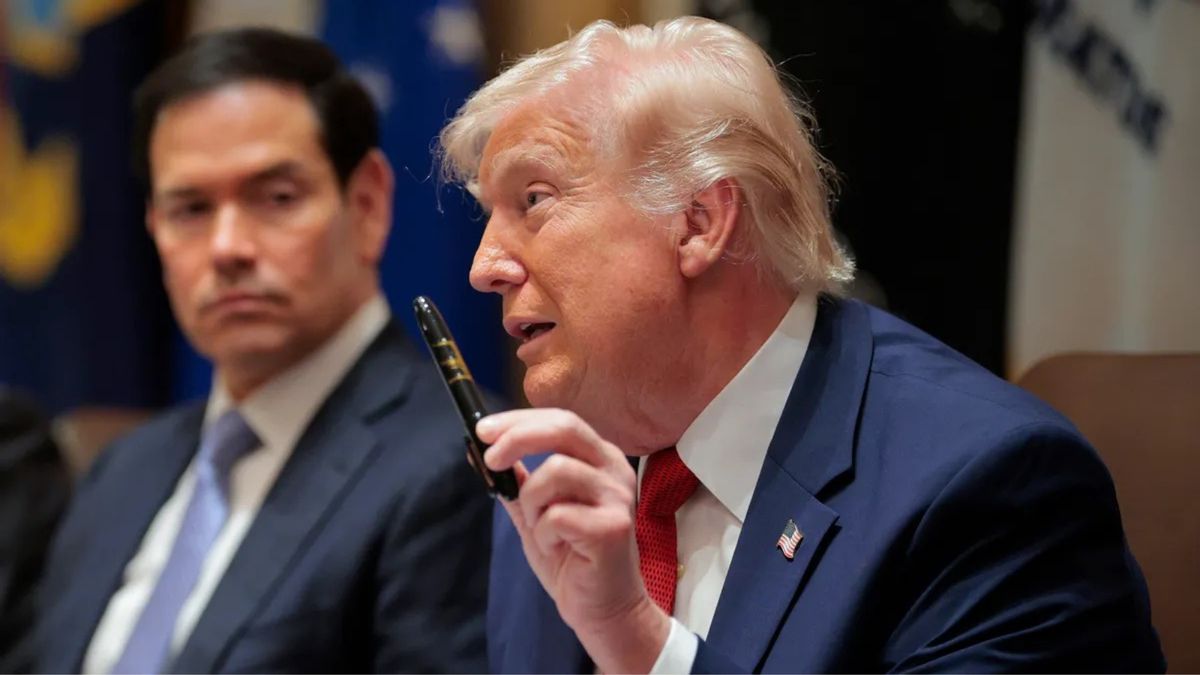 U.S. President Donald Trump holds up a Sharpie marker as he speaks during a Cabinet meeting.