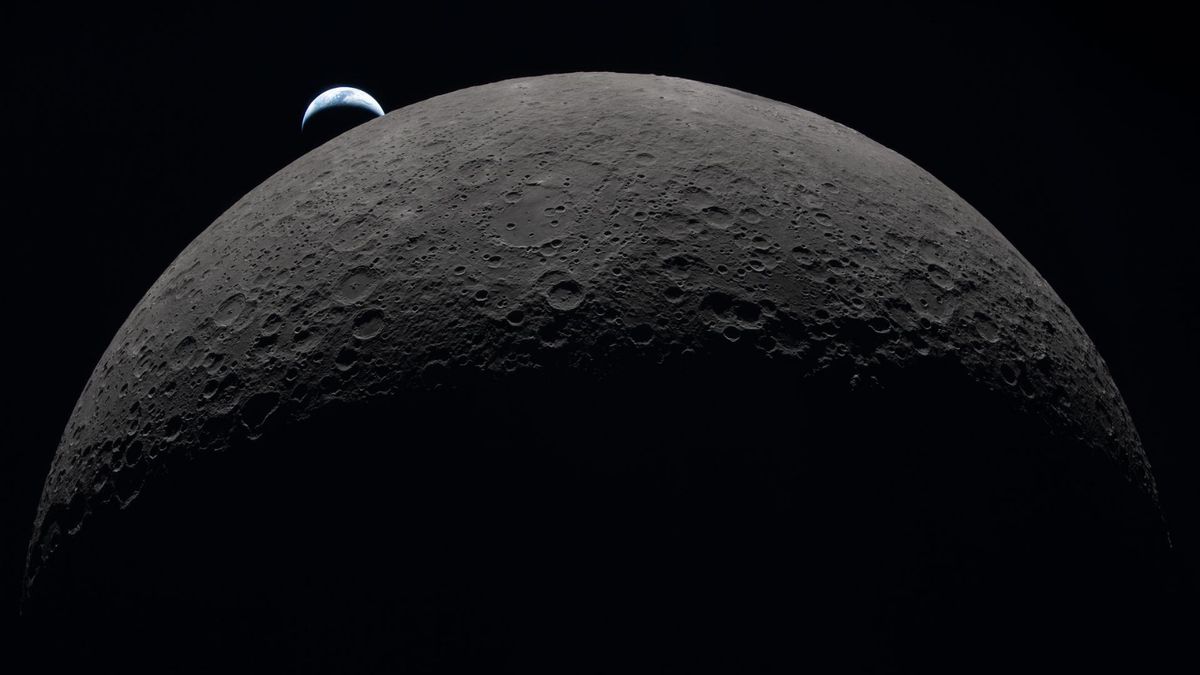 High definition image of the moon and its craters with a blue Earth visible in the background, partially obscured by shadow. 