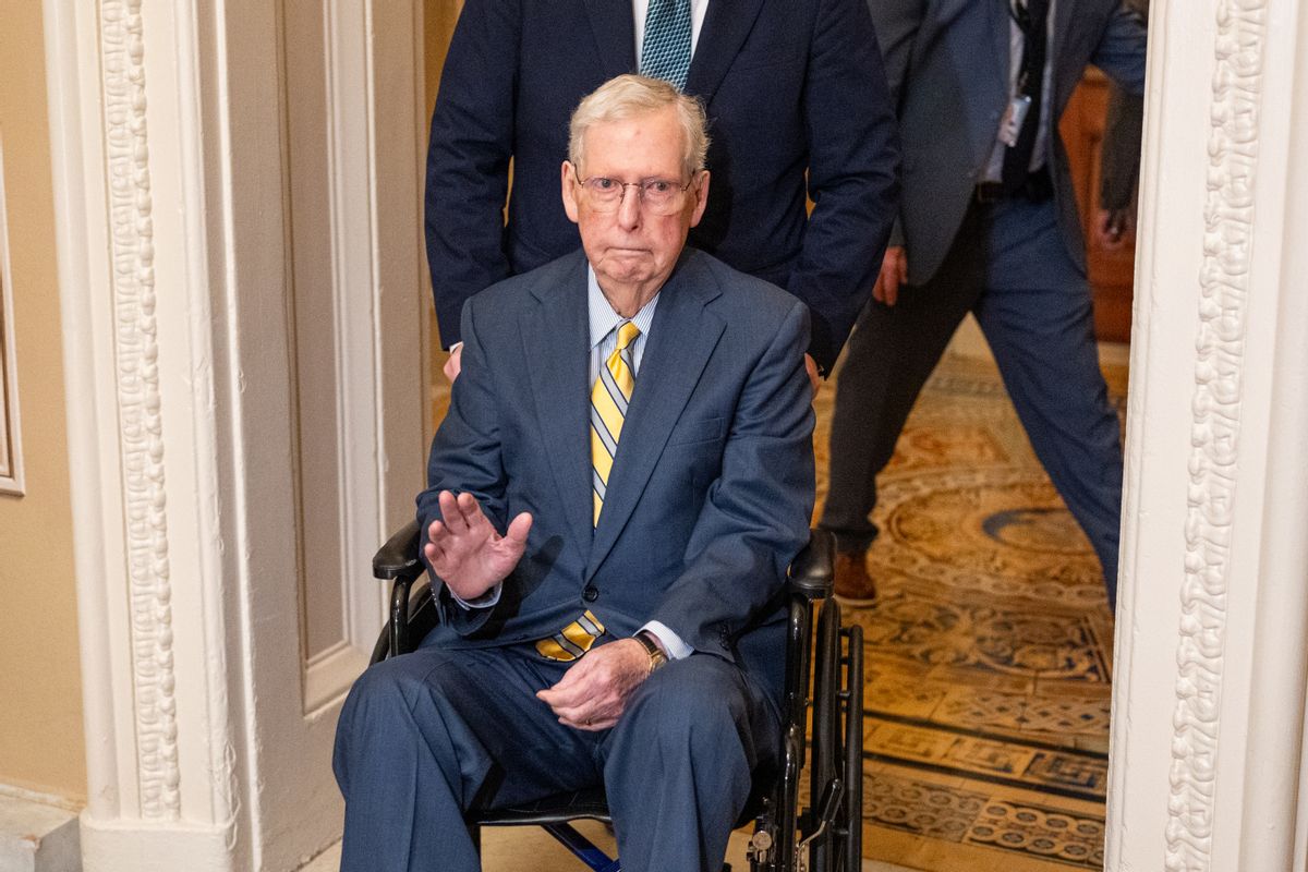 Image shows Sen. Mitch McConnell on a wheelchair.