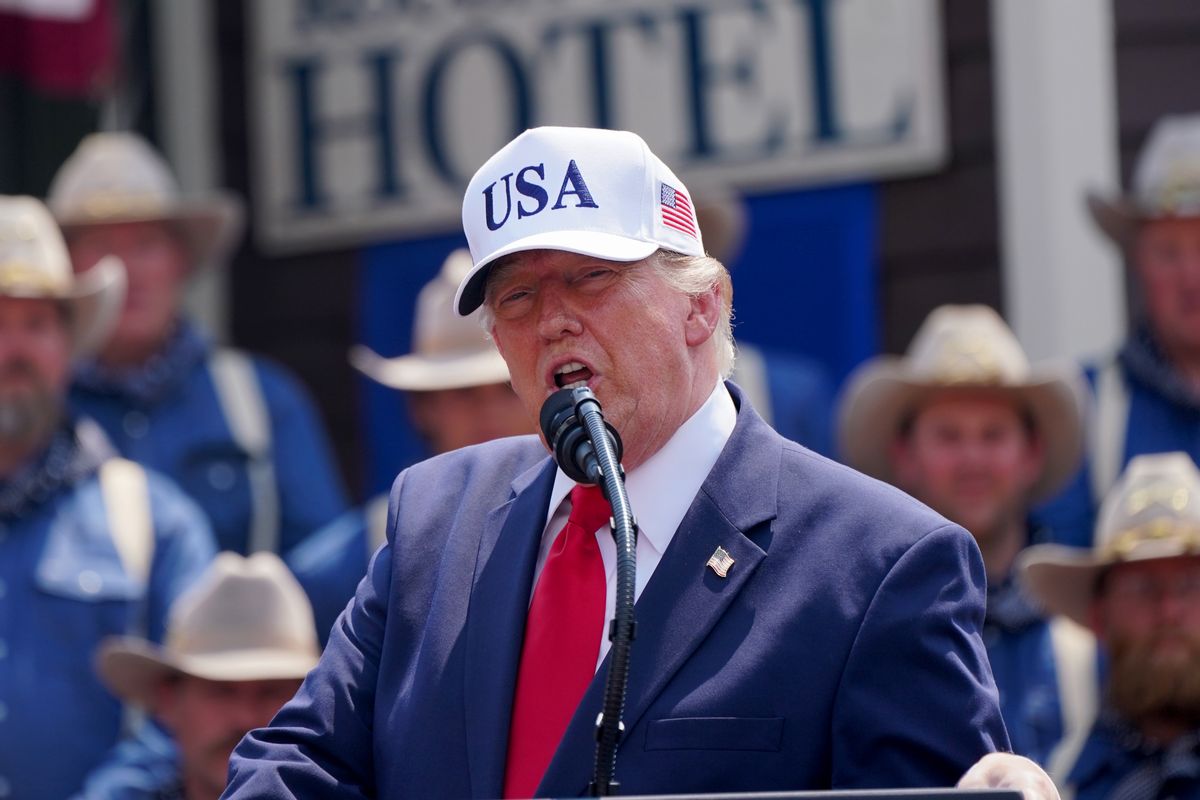 Image shows U.S. President Donald Trump in a USA cap, while making a speech.