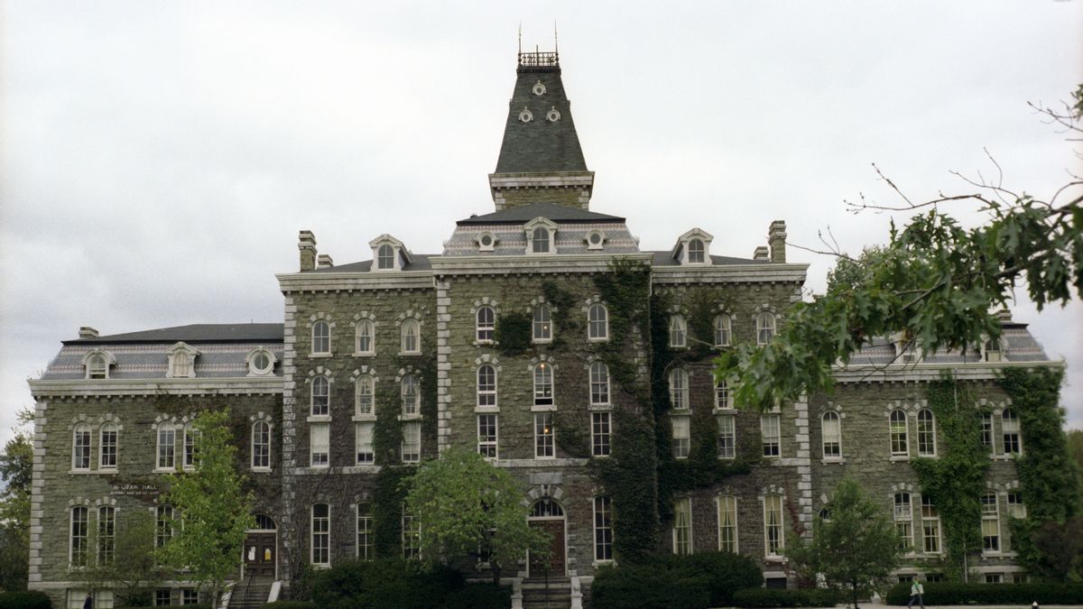 A building at Cornell University set against a cloudy sky.