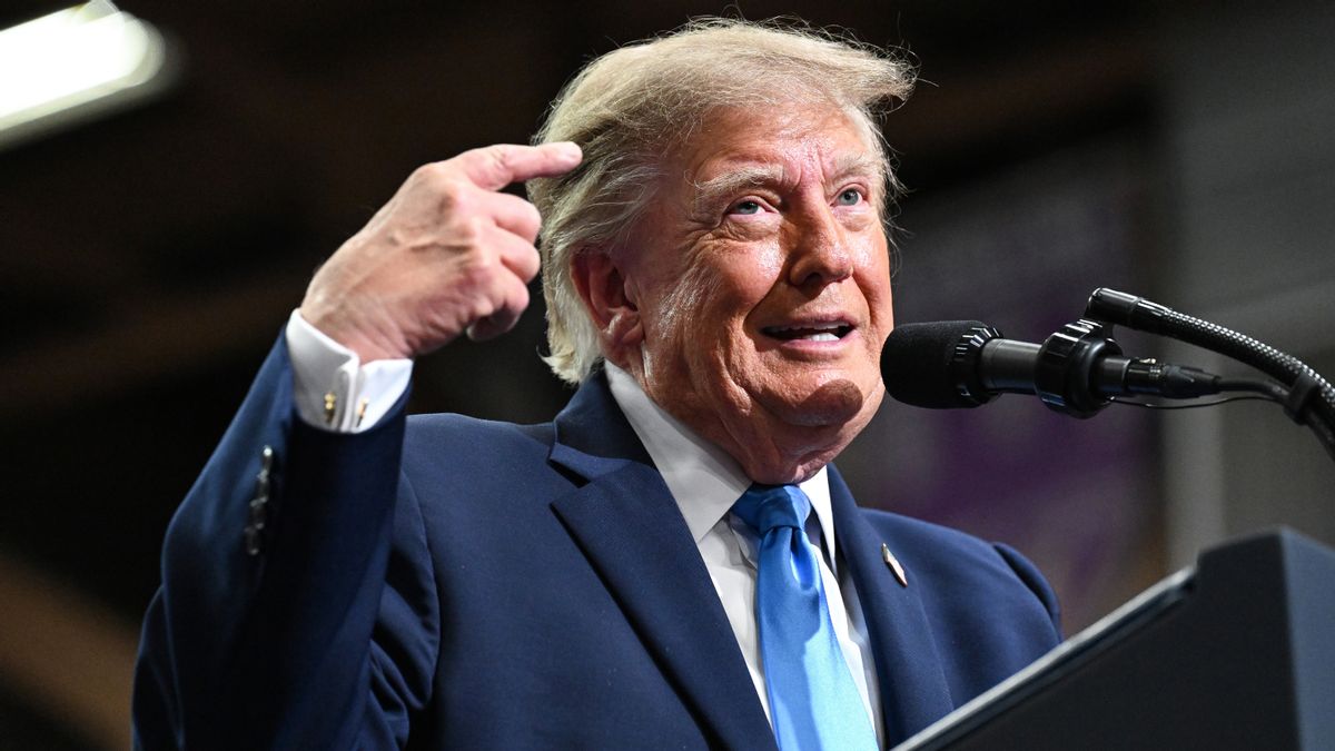 U.S. President Donald Trump speaks in Vandalia, Ohio, wearing a navy suit, blue tie and white shirt.