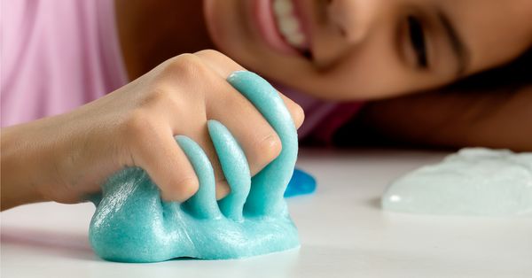 Child playing with slime toy