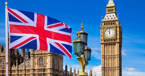 Parliament with British flag flying in front of it