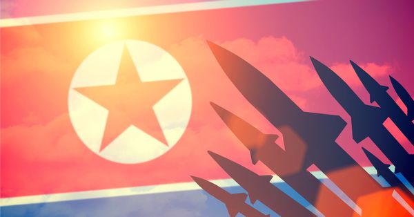 North Korean flag with missile silhouettes.