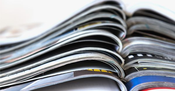 Stack of open magazines