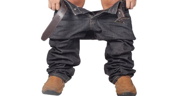 Lower half of man with pants down