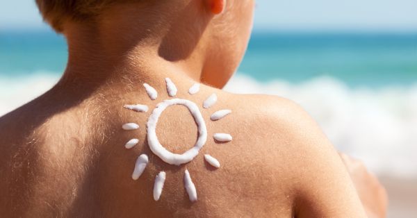 Child with sunscreen on back