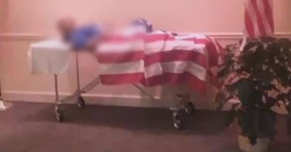 Body of dead veteran draped with American flag