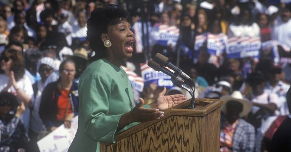Maxine Waters speaking in front of a crowd