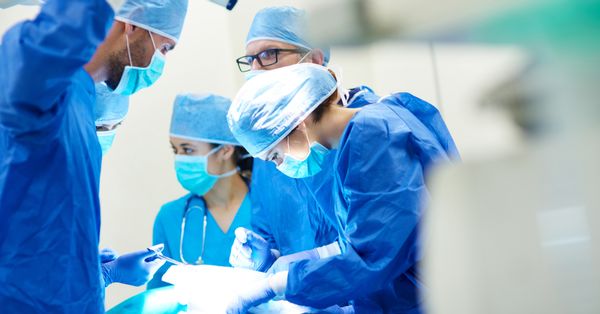 Surgeons working on a patient