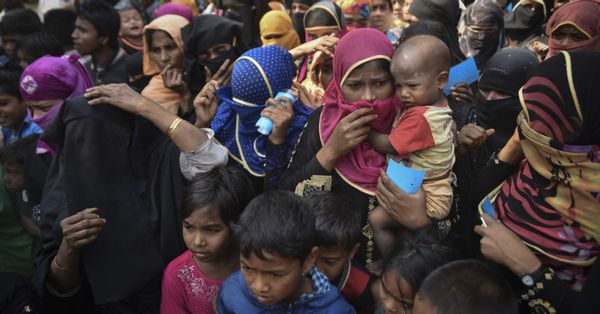 COX' BAZAR, BANGLADESH - MARCH 16, 2017 : Rohingya refugees from Myanmar waiting for food aid in Kutupalong refugee camp near Cox's Bazar, Bangladesh.