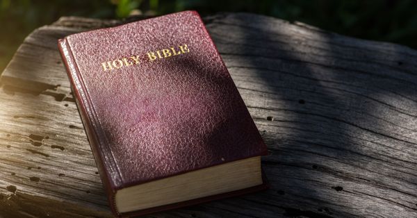 Bible on a wooden table.
