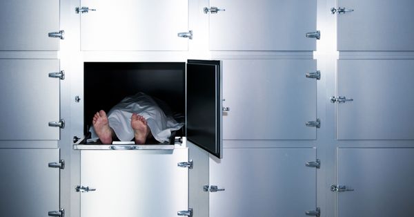 Feet sticking out of drawer in morgue