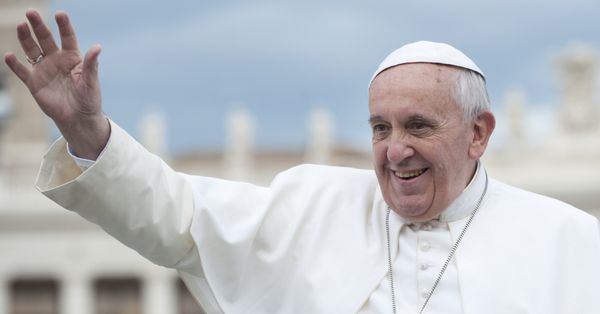 Pope Francis waving from the Popemobile.