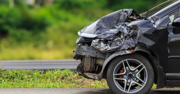 Car with crushed front bumper from an accident