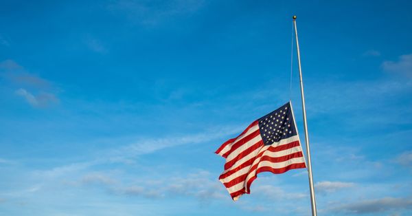 American flag at half mast.